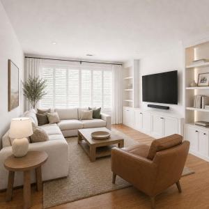 a white living room with a couch and a tv at Vail Pines Stay in Vail