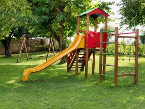 a playground with a slide in a park at Fior di Pesco in Sommacampagna