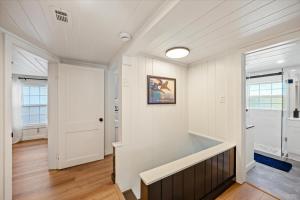 an empty room with a white wall and a door at The Pearl in Pensacola +56 photos
