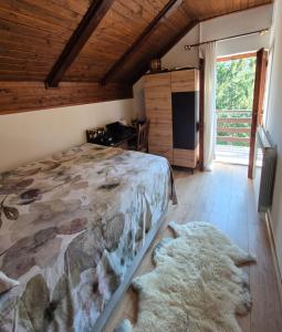 a bedroom with a bed and two rugs at Villa DORA in Vrbovsko +32 photos