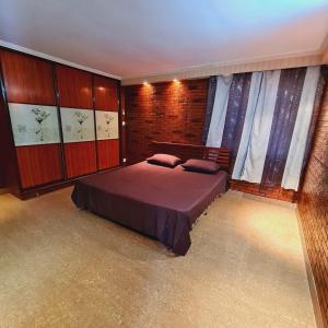 a bedroom with a large bed in a room at Paradise Pacifica in Pacific Harbour