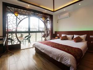 Voodi või voodid majutusasutuse Wuzhen On Memory Inn toas