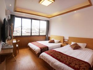 Voodi või voodid majutusasutuse Wuzhen On Memory Inn toas