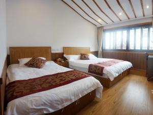 Voodi või voodid majutusasutuse Wuzhen On Memory Inn toas