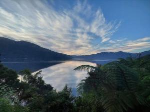a view of a large body of water with mountains at Endeavour View Eco Cabin in Endeavour Inlet +7 photos