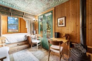 a bedroom with a bed and a desk in a room at Escape to Rustic Studio Fireplace Modern Comfort in Julian