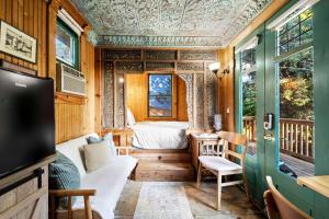a small room with a bed and a tv at Escape to Rustic Studio Fireplace Modern Comfort in Julian