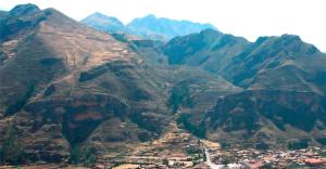 an aerial view of a mountain range with a town at Apartamentos Pachatusan in Pisac