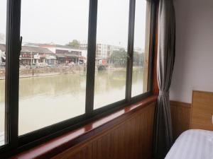 Voodi või voodid majutusasutuse Wuzhen On Memory Inn toas