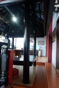 a room with a bench in the middle of a building at Hy ReDz in Palopo