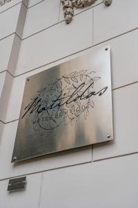 a sign on the side of a building with writing at Matildas Hotel Boutique in Santiago