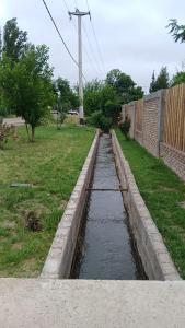 a small canal of water in a yard at La Reina in San Rafael