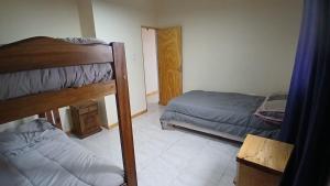 a bedroom with two bunk beds and a bed at La Reina in San Rafael