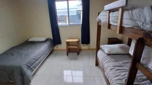 a room with two bunk beds and a window at La Reina in San Rafael +12 photos