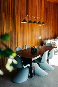 a dining room with a table and chairs at Threefold in Swansea +49 photos