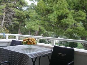 a bowl of fruit sitting on a table on a balcony at Apartments Despot Zaostrog RY in Zaostrog