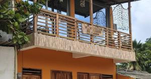 a balcony on the side of a house at Casa Completa - Macondo Beach House in Rincón