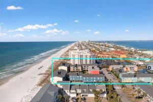 an aerial view of the beach and buildings at Villas on the Gulf K-2 in Pensacola Beach