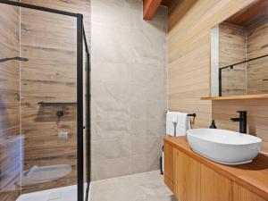 a bathroom with a sink and a glass shower at Ridge Way Views in Mansfield