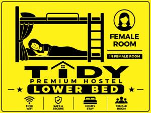 a poster of a person laying in a bunk bed at TIDY Premium Hostel, Sharjah in Sharjah