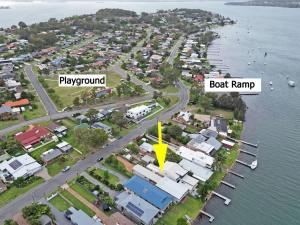 arial view of a city with a boat ramp and a boat ramp at Balmoral Waterfront Escape at Lake Macquarie in Balmoral