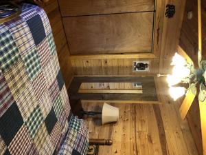 an inside view of a tiny house with a wooden floor at 2BR/1BA Cabin | Hot Tub | Ocoee River Area | Wifi in Copperhill