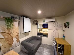 a living room with a couch and a table at Alf's Guesthouse in Panglao Island