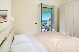 A bed or beds in a room at Beaurivage