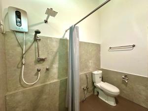 a bathroom with a shower with a toilet and a shower at Body,Mind & Soul in Bentota