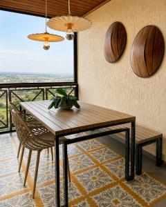a dining room with a wooden table and chairs at Luxury flat in Monte Castelo in Sairé