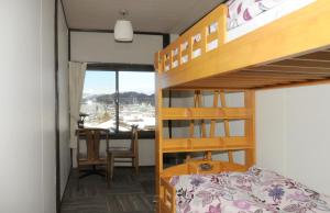 Voodi või voodid majutusasutuse Sakura Guest House toas