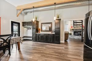a kitchen with a table and a dining room at Country Style Home 4br 2bth in Brewer