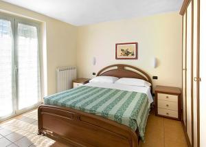 A bed or beds in a room at Beaurivage