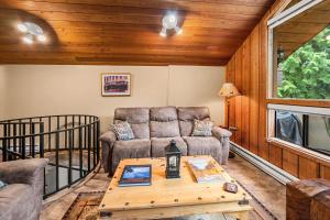 a living room with a couch and a table at Limber Pine Townhome and 2BDR Stay in Whitefish