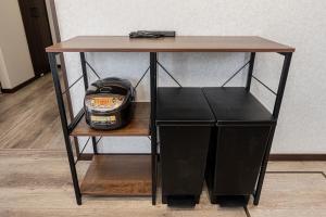 a table with a helmet sitting on a shelf at 富士飛鳥 in Fujiyoshida