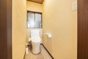 a small bathroom with a toilet in a room at 富士飛鳥 in Fujiyoshida +11 photos