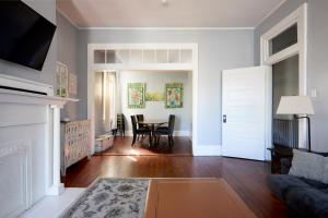 a living room with a table and a couch at Downtown Savannah Oasis in Savannah