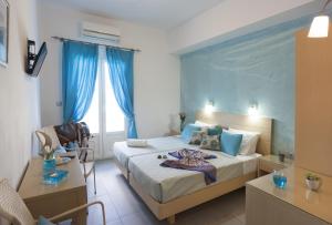 Кровать или кровати в номере Blue Harmony Hotel