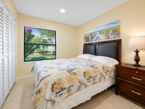 a bedroom with a bed and a dresser and a window at 3608 Orlando Vacational 1st floor in Orlando