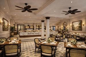 a dining room with tables and chairs and a restaurant at Le Mont Yên Bái in Yên Bái