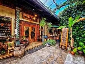 a restaurant with plants in front of a building at JA Hotel Namba-SOUTH難波南 in Osaka