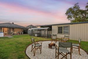 a backyard with chairs and a fire pit at Sunday Valley in Cessnock
