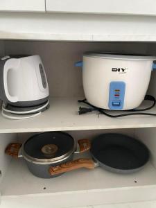 a kitchen appliance sitting on top of a shelf at CJ cozy tiny home in Santa Barbara +4 photos