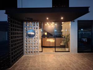 a entrance to a wine store at night at Angela Stay in Pattaya
