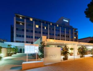 a hotel with a sign in front of it at INNSiDE by Meliá Palma Bosque in Palma de Mallorca