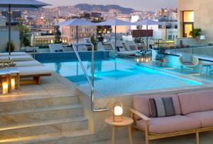 a swimming pool on the roof of a building at ME by Meliá Barcelona in Barcelona +98 photos