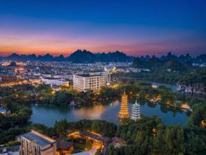 a view of a city with a river and mountains at Four Points by Sheraton Guilin Central in Guilin
