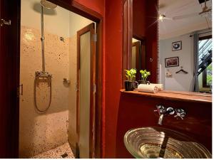 a bathroom with a sink and a mirror at Inthira Thakhek in Thakhek +58 photos