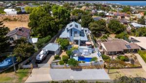 an aerial view of a house with a van parked in front at Quinns Oasis in Quinns Rocks