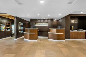 a lobby of a store with wooden walls and floors at Courtyard by Marriott St. Augustine I-95 in St. Augustine +61 photos